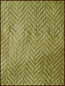 Apron hem stitching detail.